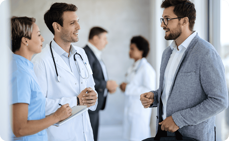 Medical professionals discussing patient care in a hospital setting.