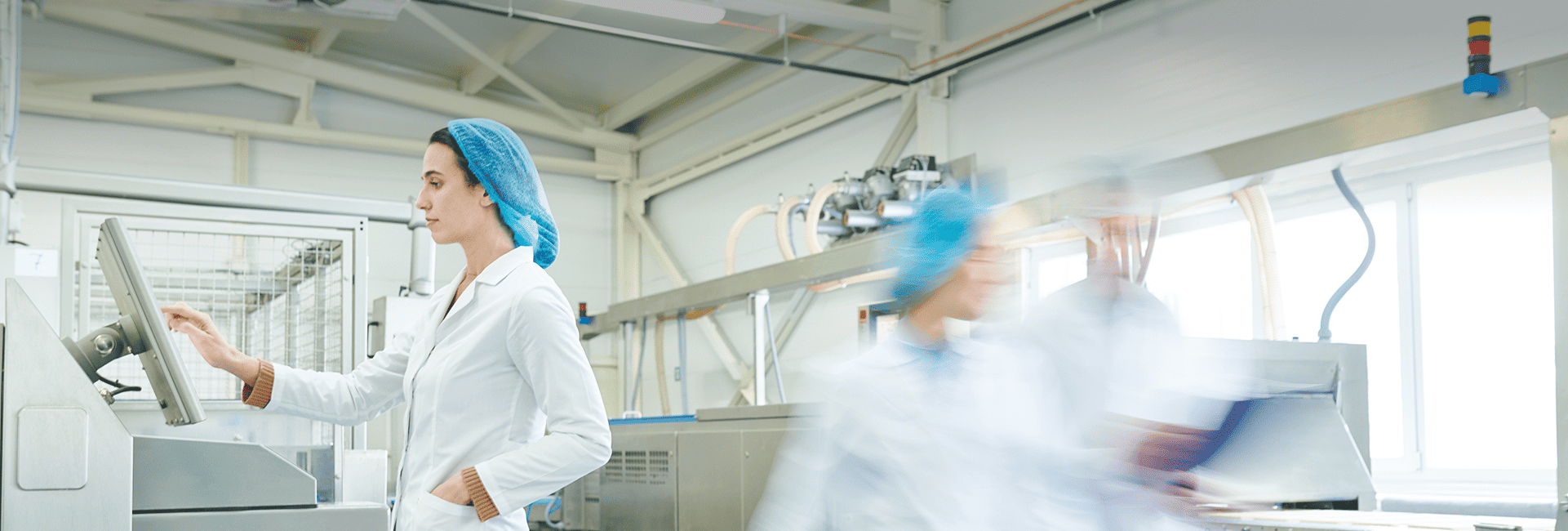 Healthcare professionals working in a hospital laboratory setting.