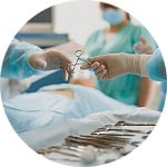 Advanced surgical team performing a procedure in a hospital operating room.
