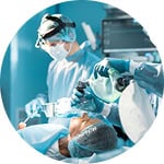 Surgical team using advanced medical instruments in a hospital operating room.