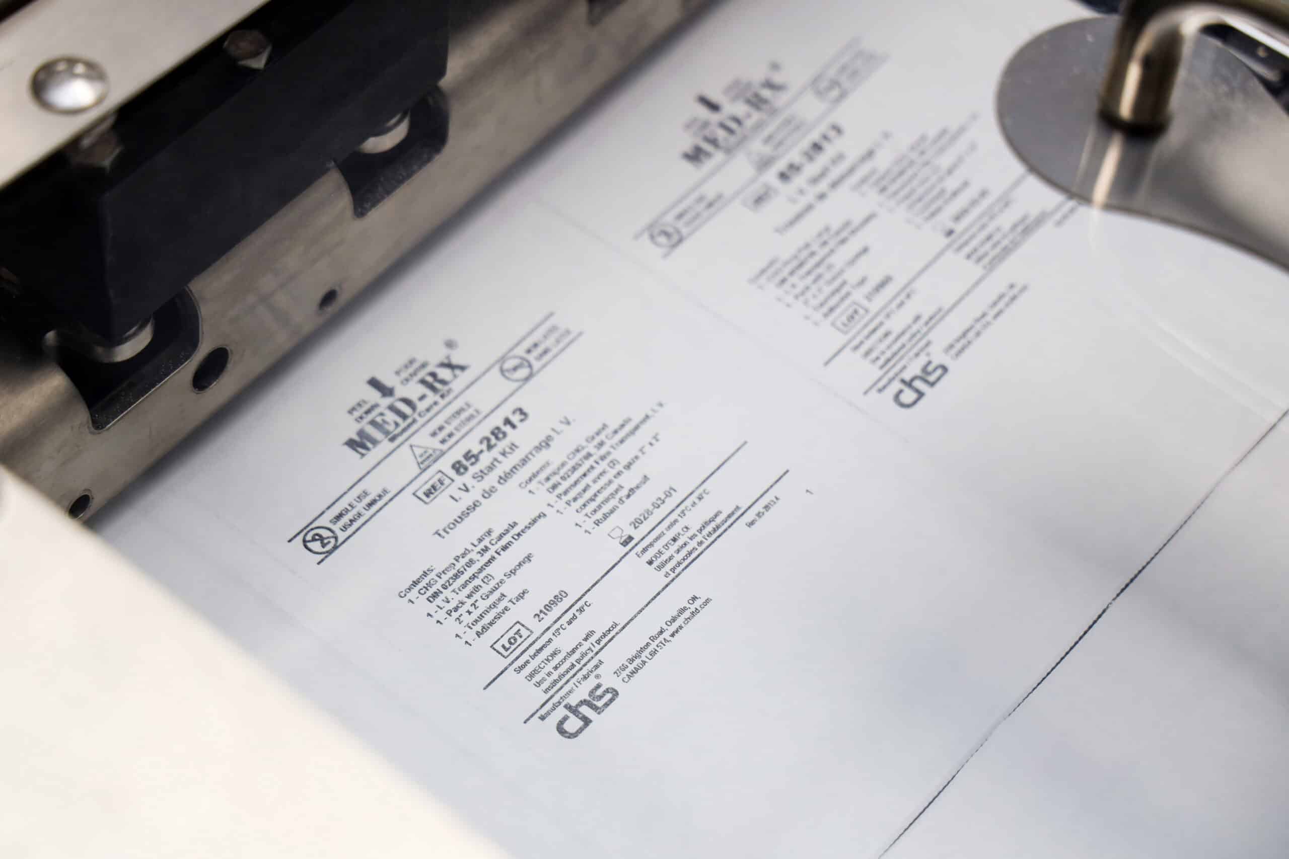 Medical document being printed on a high-speed printer at Canadian Hospital Specialties Ltd.