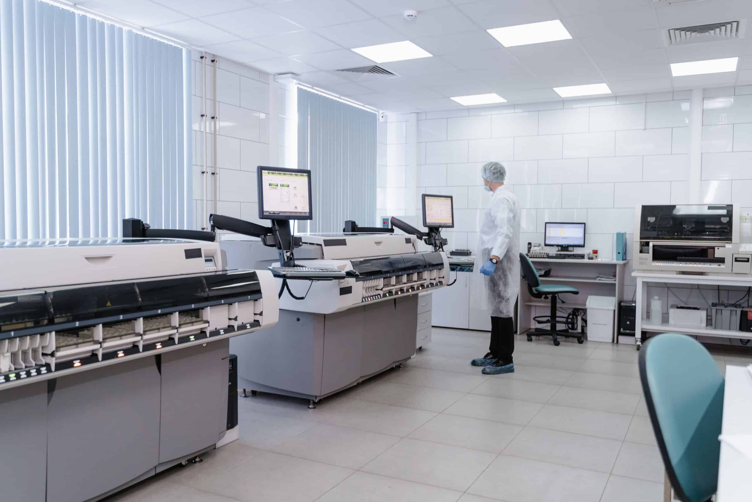 High-tech medical laboratory with advanced diagnostic equipment and a scientist in a white coat.