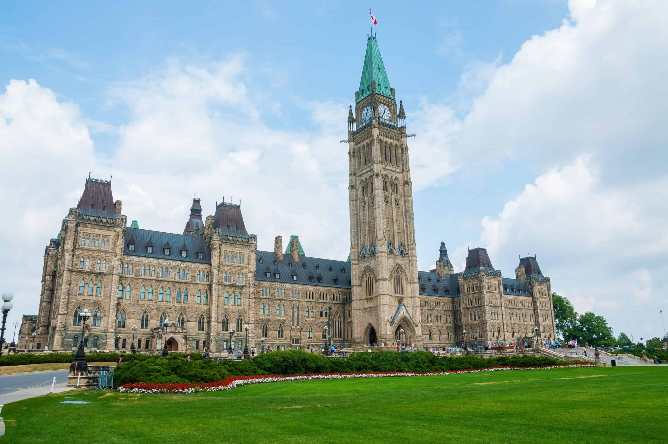 Historic government building with clock tower and Gothic architecture in Ottawa.